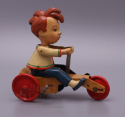 Заводная механическая игрушка "Мальчик на велосипеде", Германия, металл